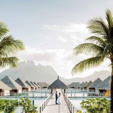 st regis couple on overwater bungalows