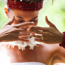 Close-up portrait of a woman wearing traditional Marquesan attire during the Marquesas Art Festival, showcasing Polynesian culture, heritage, and craftsmanship.