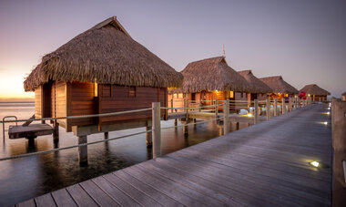 Spacifica Travel Manava Beach Resort and Spa Moorea Overwater Bungalows at Sunset