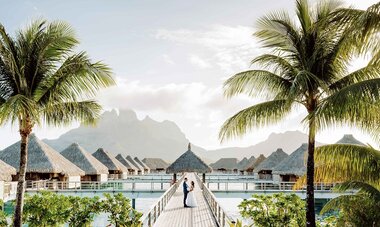 st regis couple on overwater bungalows